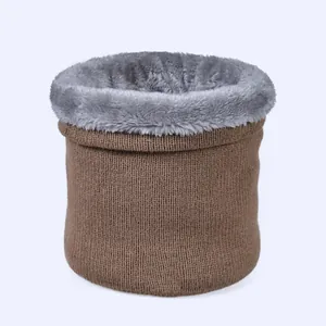 Detail of brown knit neck warmer featuring a soft grey faux fur lining for winter warmth