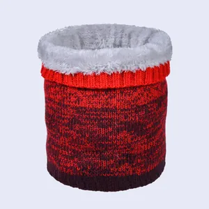 Detail of winter neck warmer showing red-purple gradient knit and thick grey fleece lining