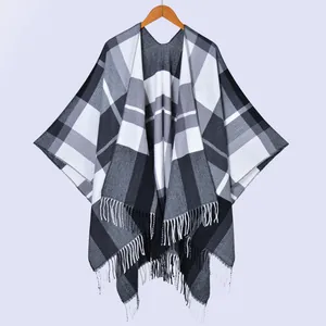 Classic black and white plaid tassel shawl cape with a soft knit texture and open front