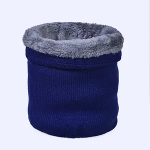 Detail of winter snood featuring navy knit exterior and thick grey plush fleece lining