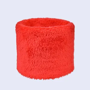 Close-up of fluffy bright red double-layer plush neck warmer with soft faux fur texture