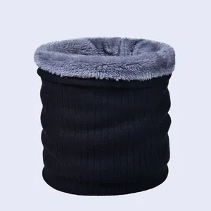 Close-up of black knitted neck warmer with thick grey fleece lining for winter warmth