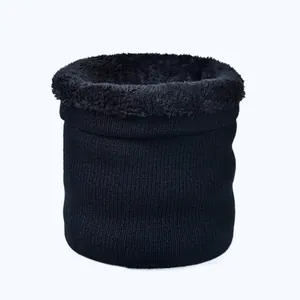 Detail of winter knit neck warmer showing thick black plush fleece lining for warmth