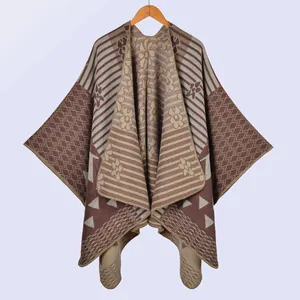 Close-up of knit shawl detailing geometric patterns and soft brown textured fabric