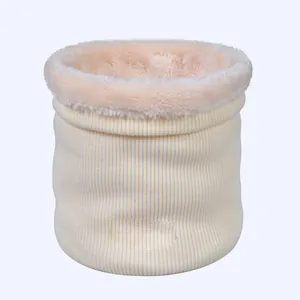 Detail of winter knit neck warmer showing beige ribbed exterior and soft plush lining