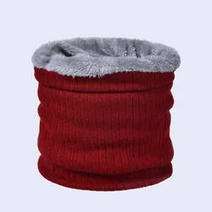 Detail of red knit neck warmer featuring thick grey plush lining for winter warmth