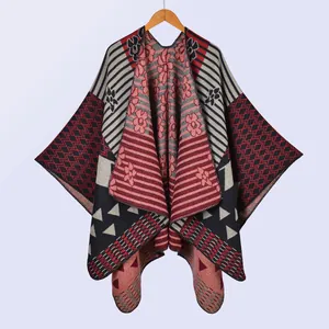 Bohemian style knitted shawl with geometric patterns and floral motifs in red and black