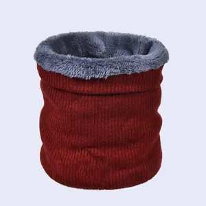 Detail of burgundy ribbed knit exterior and soft grey faux fur lining on winter neck warmer