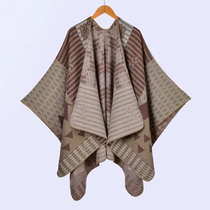 Detailed knit texture and geometric bohemian pattern on warm winter poncho shawl