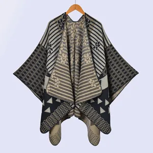 Detail of knit shawl featuring geometric floral patterns and jacquard texture
