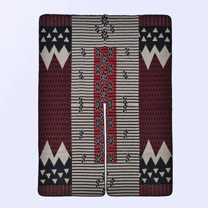 Detailed close-up showing knitting texture and geometric ethnic patterns of the winter poncho