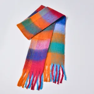 Close-up of thick rainbow plaid scarf with colorful mohair texture and long fringe details