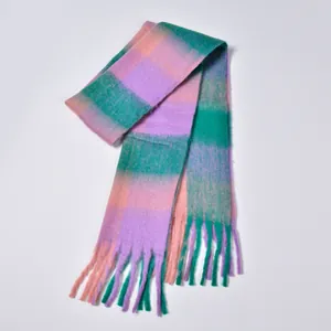 Detailed macro view of colorful plaid scarf with thick brushed texture and long tassels