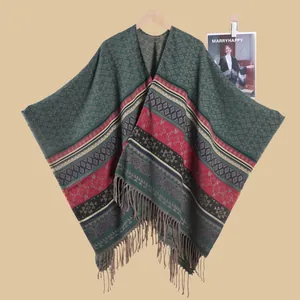 Close-up of ethnic knit shawl featuring geometric patterns and fringe tassel details
