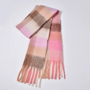 Close-up of thick rainbow plaid scarf with soft fringe and warm pastel color block
