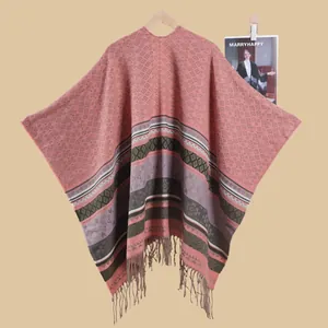 Detailed view of the pink retro boho shawl featuring geometric patterns and fringe tassels