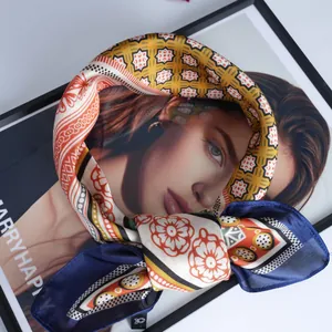 Silk-textured square scarf with geometric floral patterns and deep blue border for women