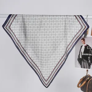 Minimalist printed satin square scarf with geometric patterns and a navy blue border