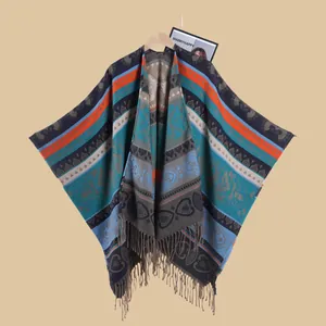 Detailed knit pattern of a bohemian poncho featuring colorful ethnic jacquard and fringe trim