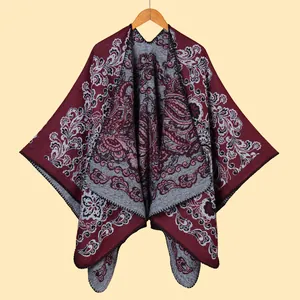 Bohemian jacquard thick shawl wrap in deep red paisley pattern on wood hanger