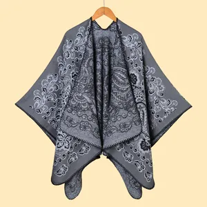 Women's gray paisley jacquard knit poncho with fringe details for autumn and winter wear