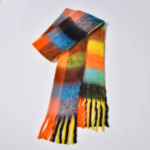 Detail of colorful rainbow plaid scarf with soft mohair texture and fluffy fringe