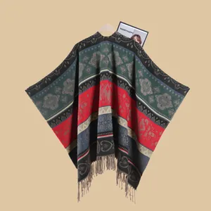 Close-up of ethnic jacquard pattern with heart and floral motifs and tassel hem detail
