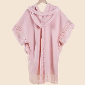 Detailed knit texture and tassel edges of the pink bohemian hooded shawl wrap