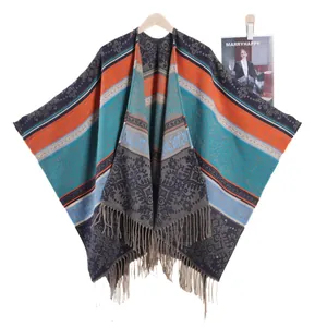 Vintage bohemian knit shawl poncho with floral patterns and long grey tassels