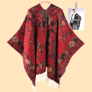 Macro detail of retro floral knit shawl with intricate jacquard patterns and fringe trim