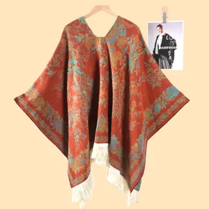 Detailed view of floral jacquard knit shawl with thick white fringe tassels