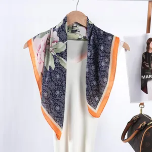 Vintage floral satin silk scarf with navy geometric patterns and bright orange borders