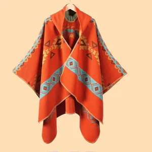 Orange ethnic hooded poncho with geometric patterns and fringe for outdoor warmth