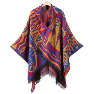 Women's hooded poncho with tassel detail featuring colorful geometric bohemian patterns