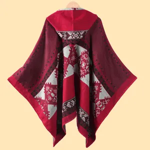 Women's ethnic hooded knit poncho with geometric Andean pattern in deep red for autumn