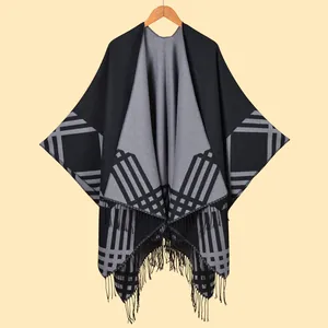 Classic reversible plaid poncho cape with fringe details in grey and black knit