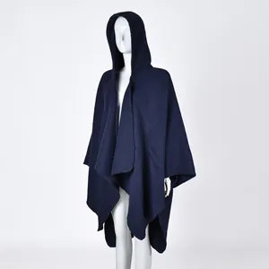 Detailed view of the dark blue hooded shawl with an asymmetrical hem and warm fleece texture