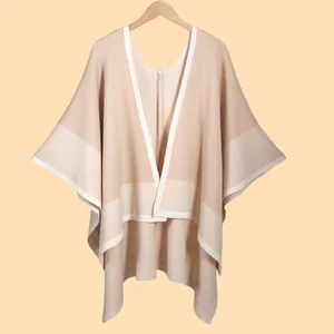 Minimalist beige and camel knit shawl cape with ivory trim for autumn and winter style