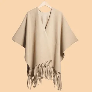 Detailed view of camel cashmere shawl featuring elegant V-neck and soft fringe hem