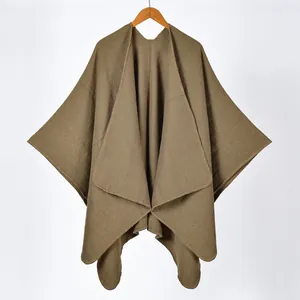Close-up of khaki cashmere-style shawl showing fine knit texture and stitched edges