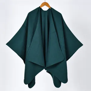 Solid color dark green cashmere-style knit poncho shawl with open front and split hem
