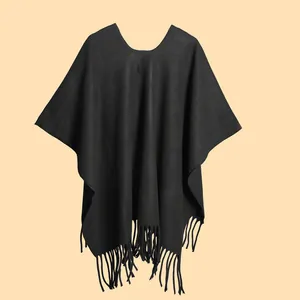Detailed close-up of premium black knitted cape featuring long elegant fringe tassels