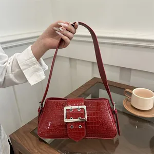 Dark red crocodile pattern shoulder bag with a large silver metal buckle and square shape