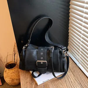 Retro black pleated underarm bag with large metal buckle and eyelet design