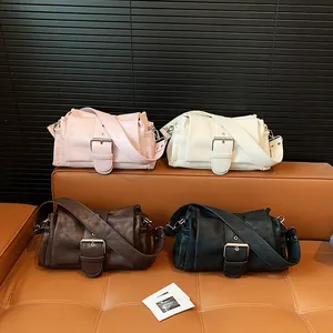 Chic leather shoulder bags in pink, white, brown and black with large silver metal buckles