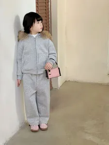 Kids grey two-piece tracksuit with hoodie and matching trousers featuring faux fur trim