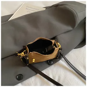 Chic quilted mini crossbody bag in khaki and brown contrast with gold hardware detail