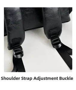 Detail of adjustable shoulder strap with buckle and lychee texture leather on black backpack