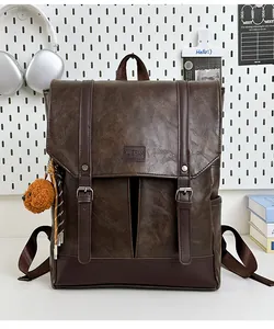 Detail view of dark brown PU leather backpack with vintage metal buckles and plush bear charm