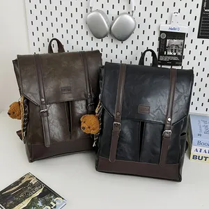 Classic faux leather backpacks in brown and black with cute bear charm and flap buckle
